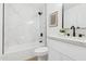 A modern bathroom featuring marble-look shower tiles, sleek fixtures, and updated vanity at 17019 E Calaveras Ave, Fountain Hills, AZ 85268