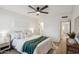 Serene bedroom with a king bed, soft lighting, and access to ensuite bathroom at 17019 E Calaveras Ave, Fountain Hills, AZ 85268