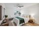Bright bedroom with neutral decor, ceiling fan, and a large window at 17019 E Calaveras Ave, Fountain Hills, AZ 85268