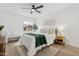 Bright bedroom features a ceiling fan, a natural color palette and modern furnishings at 17019 E Calaveras Ave, Fountain Hills, AZ 85268