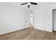 This bedroom boasts wood flooring and white walls at 17019 E Calaveras Ave, Fountain Hills, AZ 85268