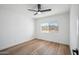Clean, minimalist bedroom featuring hardwood floors and a view to the outside at 17019 E Calaveras Ave, Fountain Hills, AZ 85268