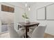 Bright dining room features light wood flooring, modern lighting, and a sliding glass door at 17019 E Calaveras Ave, Fountain Hills, AZ 85268