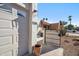 The exterior of the home showcases drought resistant landscaping, a garage, and a charming courtyard entrance at 17019 E Calaveras Ave, Fountain Hills, AZ 85268
