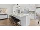 Bright, modern kitchen featuring a white quartz countertop island with seating and stainless steel appliances at 17019 E Calaveras Ave, Fountain Hills, AZ 85268