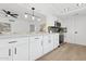 Stylish kitchen with white cabinets, modern appliances, and a breakfast bar at 17019 E Calaveras Ave, Fountain Hills, AZ 85268