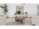 Cozy living room featuring bright natural light, a light wood floor, and comfortable neutral furniture at 17019 E Calaveras Ave, Fountain Hills, AZ 85268