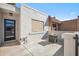 Private front patio with fire pit, a stylish door, and tiled roof at 17019 E Calaveras Ave, Fountain Hills, AZ 85268