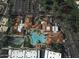 Aerial view showcasing the community clubhouse, featuring multiple pools, lush landscaping, and ample parking at 17718 N Desert Flower Trl, Surprise, AZ 85374