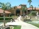 Beautiful clubhouse with Spanish-style architecture, a charming courtyard, and well-maintained landscaping at 17718 N Desert Flower Trl, Surprise, AZ 85374
