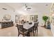 Elegant dining room featuring a large table, stylish chairs, and an open layout at 17718 N Desert Flower Trl, Surprise, AZ 85374