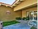 Charming village salon with outdoor seating, lush green spaces, and easy bicycle parking at 17718 N Desert Flower Trl, Surprise, AZ 85374