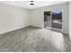 Bedroom features a large sliding door leading to an outdoor area, tile floor, and backyard views at 1913 N Verano Way, Chandler, AZ 85224