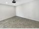 A clean, brightly lit bedroom with tiled floors and modern lighting at 1913 N Verano Way, Chandler, AZ 85224
