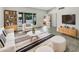 Bright living room with modern furniture, stylish rug, and view of the front yard at 1913 N Verano Way, Chandler, AZ 85224