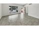 Bright and airy living room featuring modern tile flooring and a view to the entry at 1913 N Verano Way, Chandler, AZ 85224
