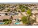 Birds eye view of a residential neighborhood showcasing well-maintained homes and green spaces at 19537 E Thornton Rd, Queen Creek, AZ 85142