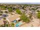 Drone shot of suburban homes with solar panels and vibrant landscaping at 19537 E Thornton Rd, Queen Creek, AZ 85142