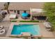 Aerial shot of backyard oasis with pool, hot tub, and shaded patio at 19537 E Thornton Rd, Queen Creek, AZ 85142