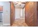 Inviting foyer features sliding barn doors, tile flooring, and a modern ceiling fan at 19537 E Thornton Rd, Queen Creek, AZ 85142