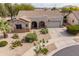 Charming single-story home featuring desert landscaping, a covered front porch, and a two-car garage at 19537 E Thornton Rd, Queen Creek, AZ 85142