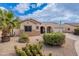 Charming single-story home featuring desert landscaping and a neutral color palette at 19537 E Thornton Rd, Queen Creek, AZ 85142