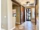 Foyer with decoratice security door, tile floors, and sliding barn doors at 19537 E Thornton Rd, Queen Creek, AZ 85142