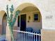 Inviting front porch with seating and decorative desert-themed security door at 19537 E Thornton Rd, Queen Creek, AZ 85142