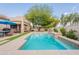 Beautiful pool area with well-maintained landscaping and a covered patio, perfect for outdoor enjoyment and relaxation at 19537 E Thornton Rd, Queen Creek, AZ 85142