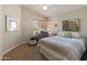 Cozy bedroom features a large window for natural light and calming decor at 19874 N 90Th Ave, Peoria, AZ 85382