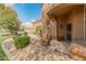 Inviting front entrance with stone accents, lush landscaping, and covered porch at 19874 N 90Th Ave, Peoria, AZ 85382