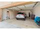 Well-organized garage with storage cabinets and room for parking a car at 19874 N 90Th Ave, Peoria, AZ 85382