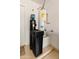 Utility room with a modern water softener system and water heater at 19874 N 90Th Ave, Peoria, AZ 85382