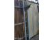 A small backyard with wooden fence and a plant hanging on the metal post at 200 E Ivanhoe St, Chandler, AZ 85225
