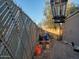 Fenced backyard area with a garden bed and an outdoor light fixture, offering privacy and charm at 200 E Ivanhoe St, Chandler, AZ 85225
