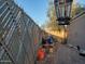 The backyard is surrounded by a chainlink fence and has a pile of debris in the corner at 200 E Ivanhoe St, Chandler, AZ 85225