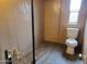 Simple, functional bathroom featuring a toilet and vinyl floors, clean and ready for customization at 200 E Ivanhoe St, Chandler, AZ 85225