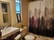 Charming bathroom with a unique shower curtain and vanity, creating a peaceful retreat at 200 E Ivanhoe St, Chandler, AZ 85225