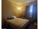 A cozy bedroom with a warm ambiance, featuring a comfortable bed and soft lighting at 200 E Ivanhoe St, Chandler, AZ 85225