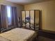 A quaint bedroom showcases a serene atmosphere, complete with a queen bed and Japanese screen at 200 E Ivanhoe St, Chandler, AZ 85225