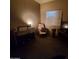 Inviting bedroom features a neutral color scheme, a comfortable chair, and ample natural light at 200 E Ivanhoe St, Chandler, AZ 85225