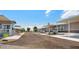 Neat community street lined with manufactured homes and covered parking at 200 E Ivanhoe St, Chandler, AZ 85225