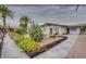 Charming front yard with desert landscaping, showcasing a unique and low-maintenance design at 200 E Ivanhoe St, Chandler, AZ 85225