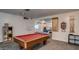 Community game room with a billiard table and a variety of cue sticks on the wall at 200 E Ivanhoe St, Chandler, AZ 85225