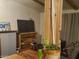 Living room featuring wood beam accents and entertainment center at 200 E Ivanhoe St, Chandler, AZ 85225