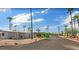 A mobile home neighborhood with palm trees under a clear blue sky with scattered clouds at 200 E Ivanhoe St, Chandler, AZ 85225