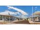 An aerial view of a community street lined with manufactured homes and covered parking spots at 200 E Ivanhoe St, Chandler, AZ 85225