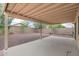 Spacious backyard featuring a covered patio and neutral rocks for easy maintenance at 2112 E Donald Dr, Phoenix, AZ 85024