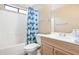 Cozy bathroom featuring a tub and shower combination with a shark-themed curtain, toilet and sink at 2112 E Donald Dr, Phoenix, AZ 85024