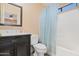 This is a bathroom including a bathtub/shower, a toilet, and a sink with drawers and cabinet space at 2112 E Donald Dr, Phoenix, AZ 85024